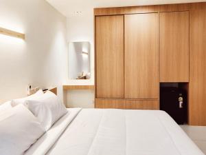 Ένα ή περισσότερα κρεβάτια σε δωμάτιο στο Laksika Place Khao Rang