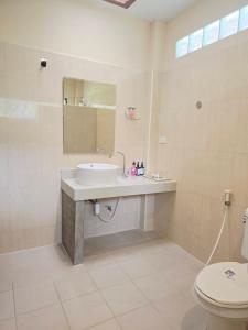 a bathroom with a sink and a toilet at D.R. Lanta Bay Resort in Ko Lanta +64 photos