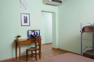 Telewizja i/lub zestaw kina domowego w obiekcie Villa Tuscany Siena