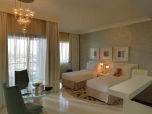 DAMAC Maison Mall Street客房内的一张或多张床位