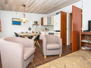 a living room with two chairs and a table at 6 person holiday home in Henne-By Traum in Henne Strand