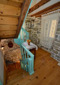a staircase in a room with a stone wall at Apartments Maja in Piran