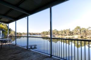 a large screened porch with a view of a lake at 42 Old Murbko Road in Morgan