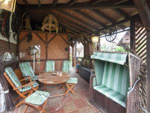 an outdoor patio with a table and chairs at Wohnung in Bad Zwesten am Edersee in Bad Zwesten