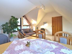 a living room with a table and a couch at Wohnung in Bad Zwesten am Edersee in Bad Zwesten +32 photos