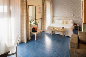 Postel nebo postele na pokoji v ubytování Ostia Antica Park Hotel & Spa
