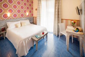 Postel nebo postele na pokoji v ubytování Ostia Antica Park Hotel & Spa
