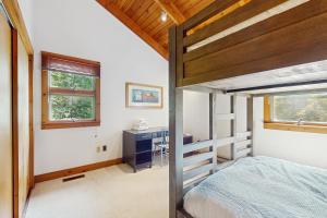 a bedroom with a bed and a desk in it at Lincoln Gap Retreat in Warren
