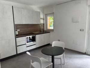 a kitchen with a table and chairs in a room at Giorgia's House in Silvi Marina