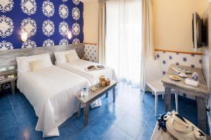 Postel nebo postele na pokoji v ubytování Ostia Antica Park Hotel & Spa