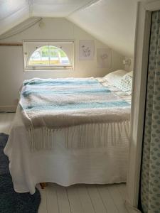 a bedroom with a large bed in a room at Summer House With Pool On Hilltop In Ostra Knall in Eskilstuna
