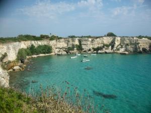 a group of boats in a large body of water at Agriturismo L'Agrumeto in Otranto