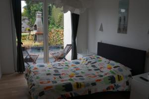 Llit o llits en una habitació de Gîte de L´ô d´Or