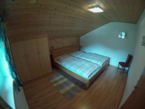 an overhead view of a bedroom with a bed and a chair at Haus Ebner Johann in Hintersee