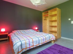 a bedroom with a bed and a book shelf at Rustic Retreat, Ovifat in Waimes