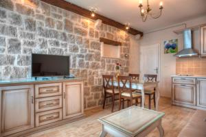 Kuchyň nebo kuchyňský kout v ubytování Piazza Apartments 1