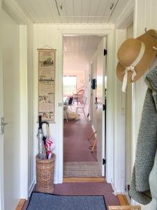 a hallway with a hallway leading to a room at Holiday Home By Limfjord With Historic Charm in Farsø
