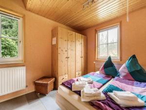 a bedroom with a bed with towels on it at Peaceful Stay in Jägersgrün in Bad Reiboldsgrün