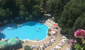 an overhead view of a large swimming pool with people in it at Hotel Olymp in Sunny Beach +11 photos