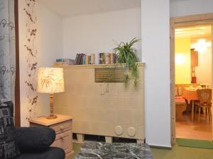 a living room with a chair and a lamp at Ferienhaus, Wernigerode in Wernigerode