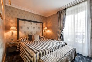 Ένα ή περισσότερα κρεβάτια σε δωμάτιο στο Villa Lutèce Port Royal