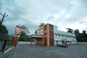 a building on the side of a street at Hotel Abaam Neil in Kumarakom