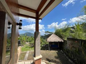 a view from the porch of a house at The Banjar Homestay in Sidemen +4 photos