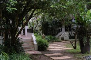 a garden with a staircase leading to a house at Barali Beach Resort Koh Chang in Ko Chang +58 photos