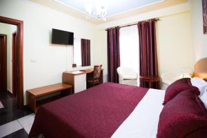 Postel nebo postele na pokoji v ubytování Orchidea Hotel