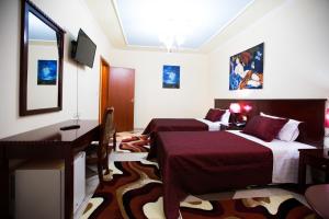 TV a/nebo společenská místnost v ubytování Orchidea Hotel