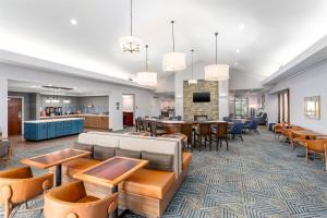 a lobby of a hospital with tables and chairs at Homewood Suites by Hilton Lexington Fayette Mall in Lexington