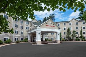 a rendering of a hotel with a large building at Hampton Inn & Suites North Conway in North Conway