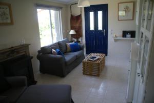 a living room with a couch and a table at O Ioannis in Kritinía