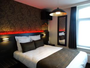 Ένα ή περισσότερα κρεβάτια σε δωμάτιο στο Hotel Kristoffel - Ontbijt inbegrepen