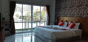 Postel nebo postele na pokoji v ubytování Hadthong Resort + 85 fotografií