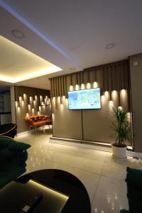 a room with a large screen on the wall at New House Hotel in Istanbul