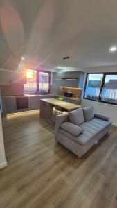 a living room with a couch and a table at Matei Rent Apt in Baia Mare
