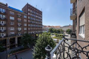 a view of a city from a balcony with buildings at Central 4BEDROOM Madách Square Apartment in Budapest +14 photos