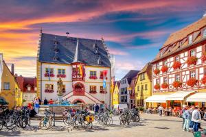 a group of bikes parked in a street with buildings at Main-Nest Volkach in Volkach +3 photos