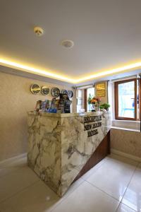 a lobby with a marble counter in a room at New House Hotel in Istanbul