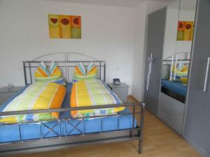 a bedroom with two bunk beds with colorful pillows at Sonnenterrasse in Elzach