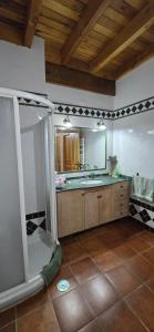a bathroom with a sink and a mirror at Casa Renacimiento in Coín +13 photos