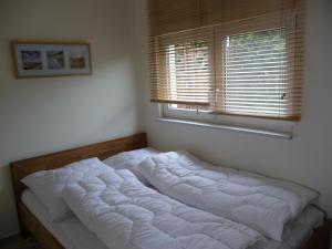 Katil atau katil-katil dalam bilik di Ferienhaus Molly
