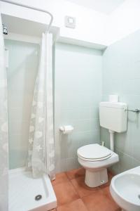 a bathroom with a toilet and a sink and a shower at Eolcalandra Case Per Vacanza in Canneto