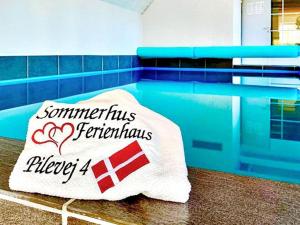 a towel sitting on the floor of a bathroom at Luxury Retreat near Beach - By Traum Ferienwohnungen in Marielyst