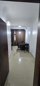 a living room with a table and a dining room at vapollo apartment in Batumi