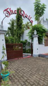 a gate with a sign in front of a building at Quila Camps and Resort, Burja in Alwar