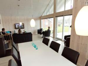 a meeting room with a white table and chairs at Luxury Retreat by the Sea - By Traum Ferienwohnungen in Høruphav