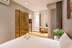 Ένα ή περισσότερα κρεβάτια σε δωμάτιο στο Sunshine Residences By 5H
