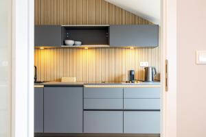 Η κουζίνα ή μικρή κουζίνα στο GoldenKey Suites +15 φωτογραφίες